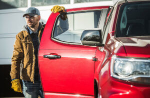 Man standing next to pickup truck