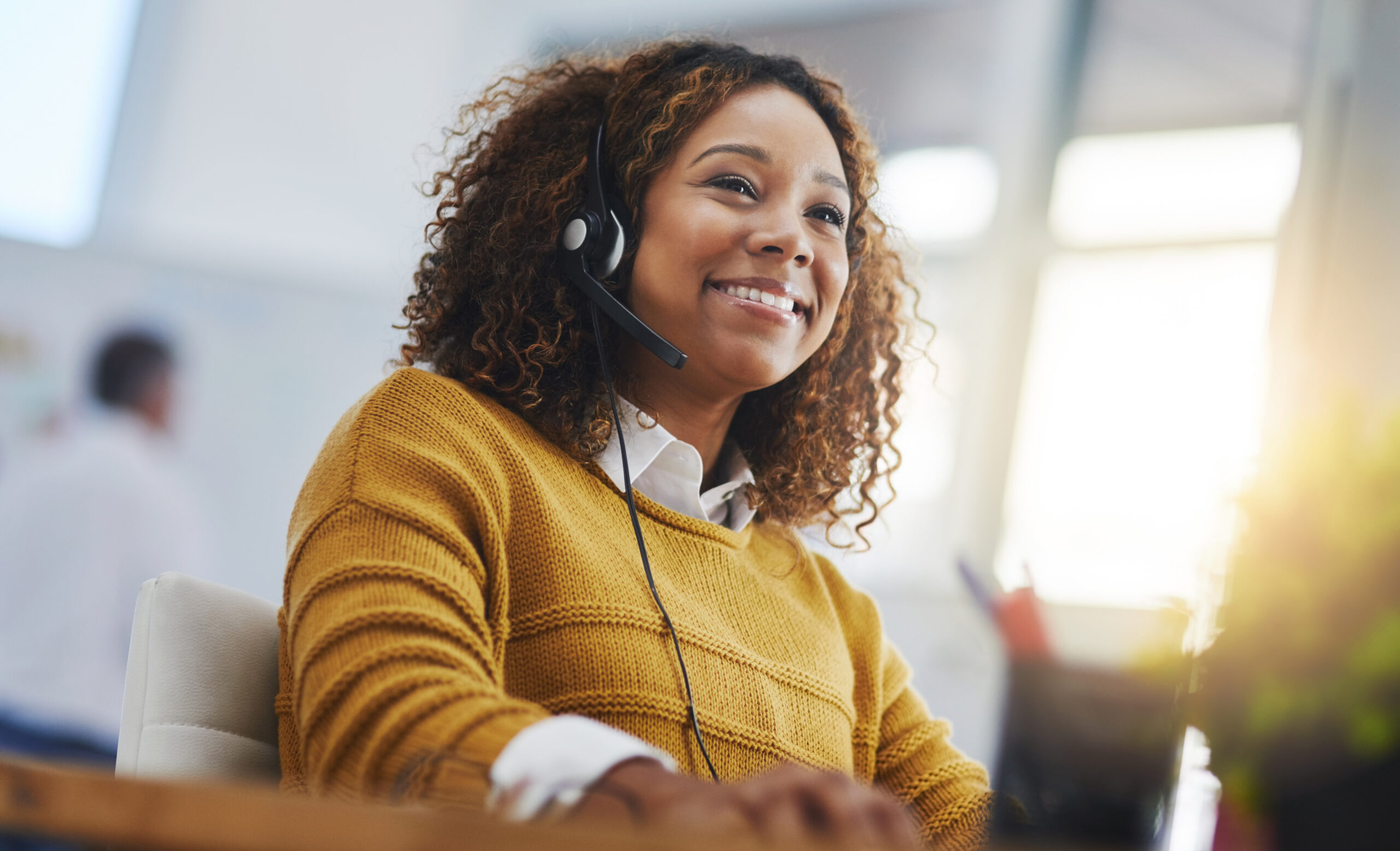 call center agent or smile with voip for consulting, listening or contact us in office. female consultant, customer service or tech support crm with headphones, microphone or help desk